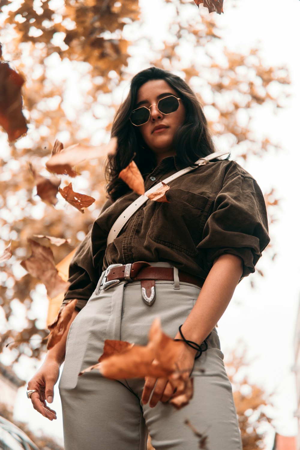 woman in black leather jacket wearing black sunglasses