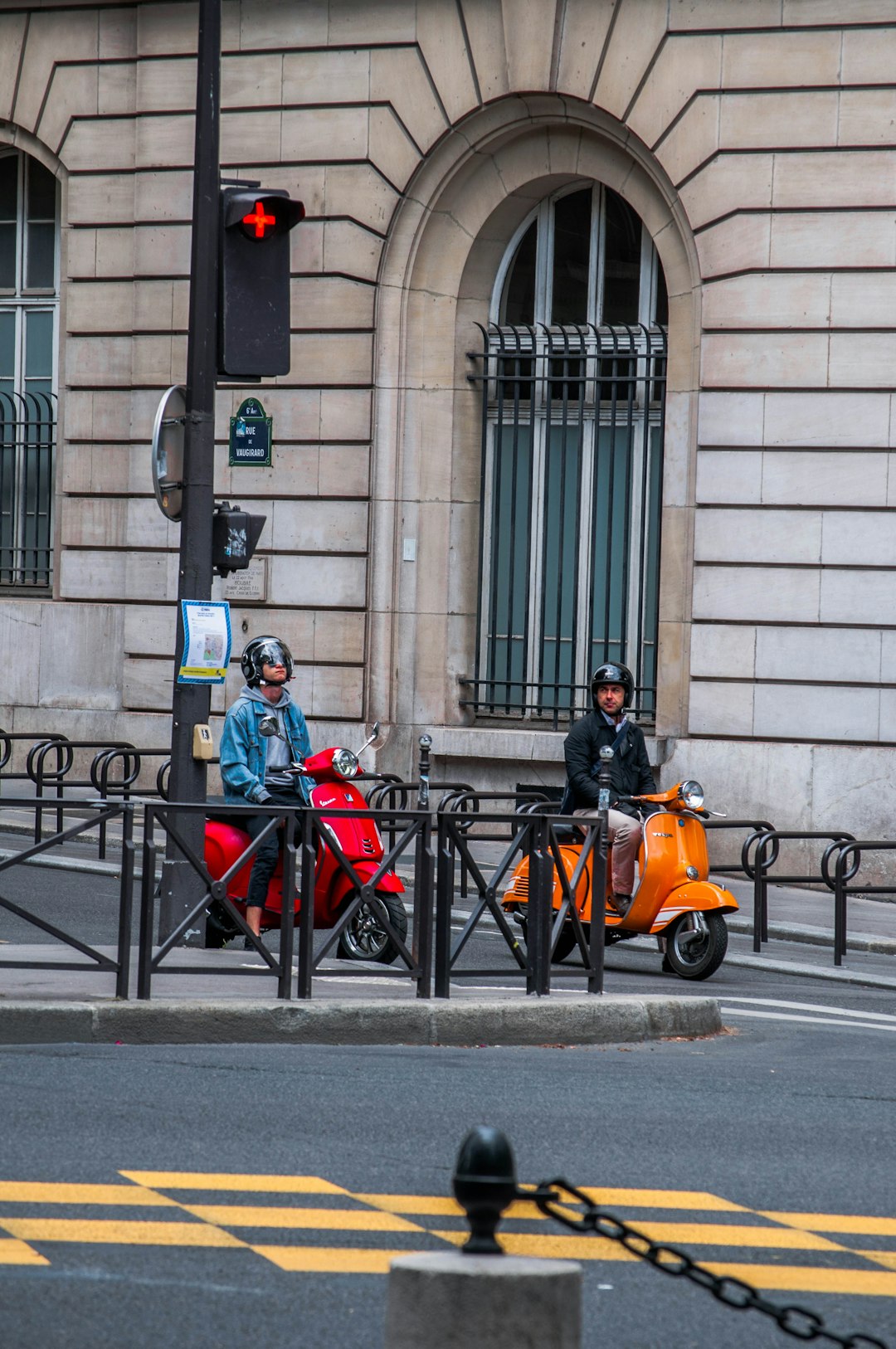 man in orange jacket riding orange motorcycle