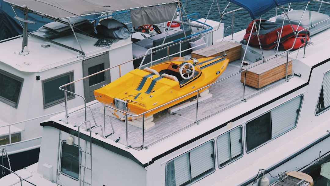 yellow and white boat on sea during daytime