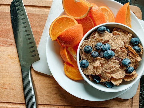A man preparing a healthy breakfast with fresh ingredients to start his wellness routine