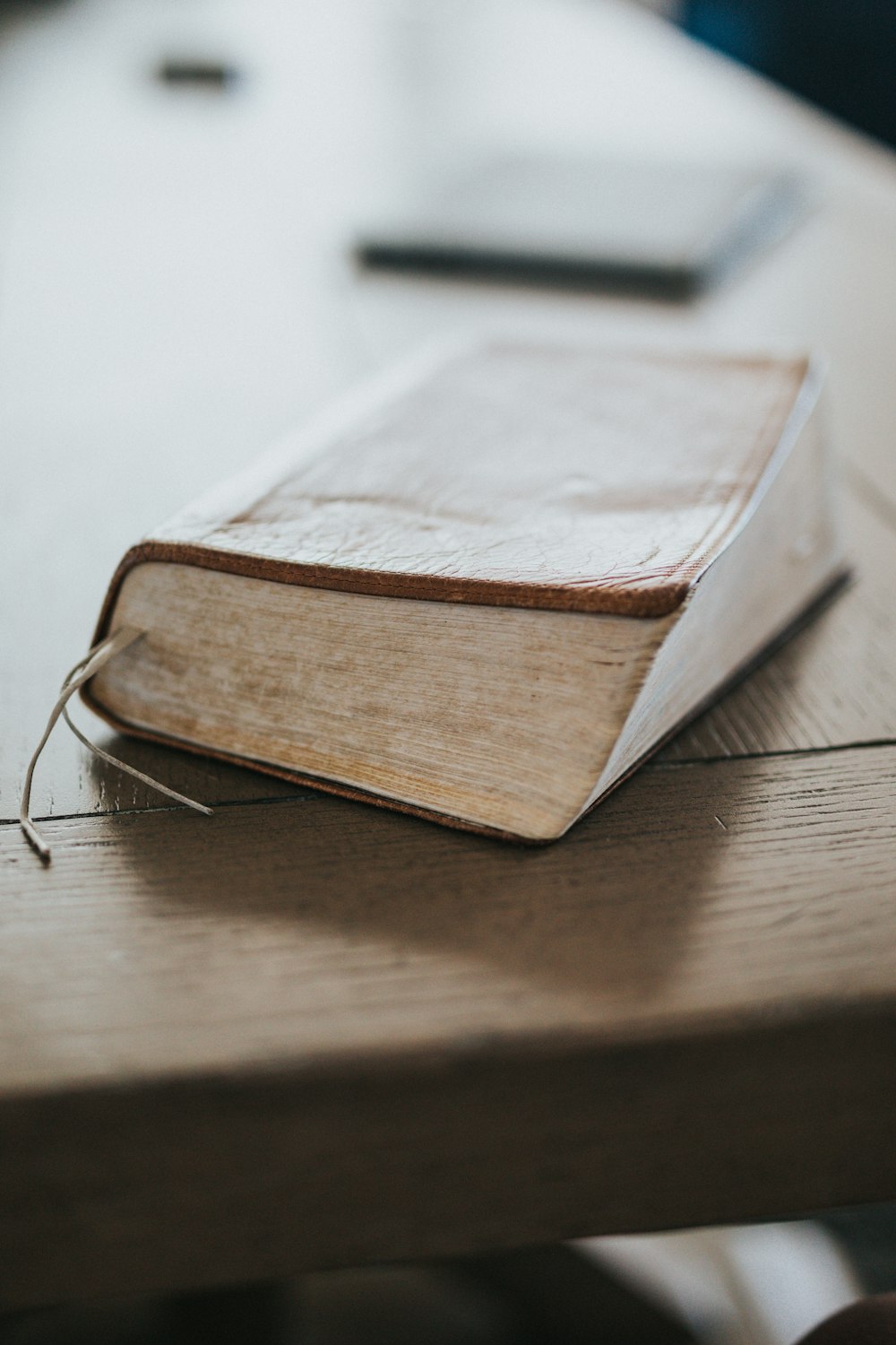 brown book on brown wooden table