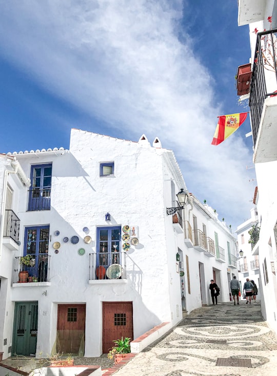 white concrete building under blue sky during daytime in Frigiliana Spain