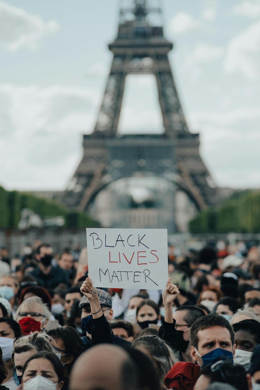 people gathering near eiffel tower during daytime