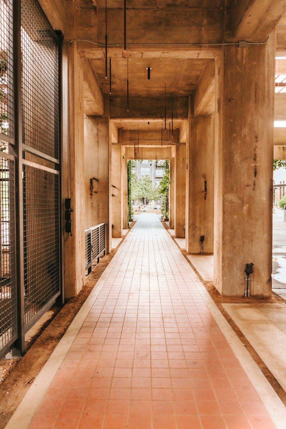 brown wooden hallway with green plants