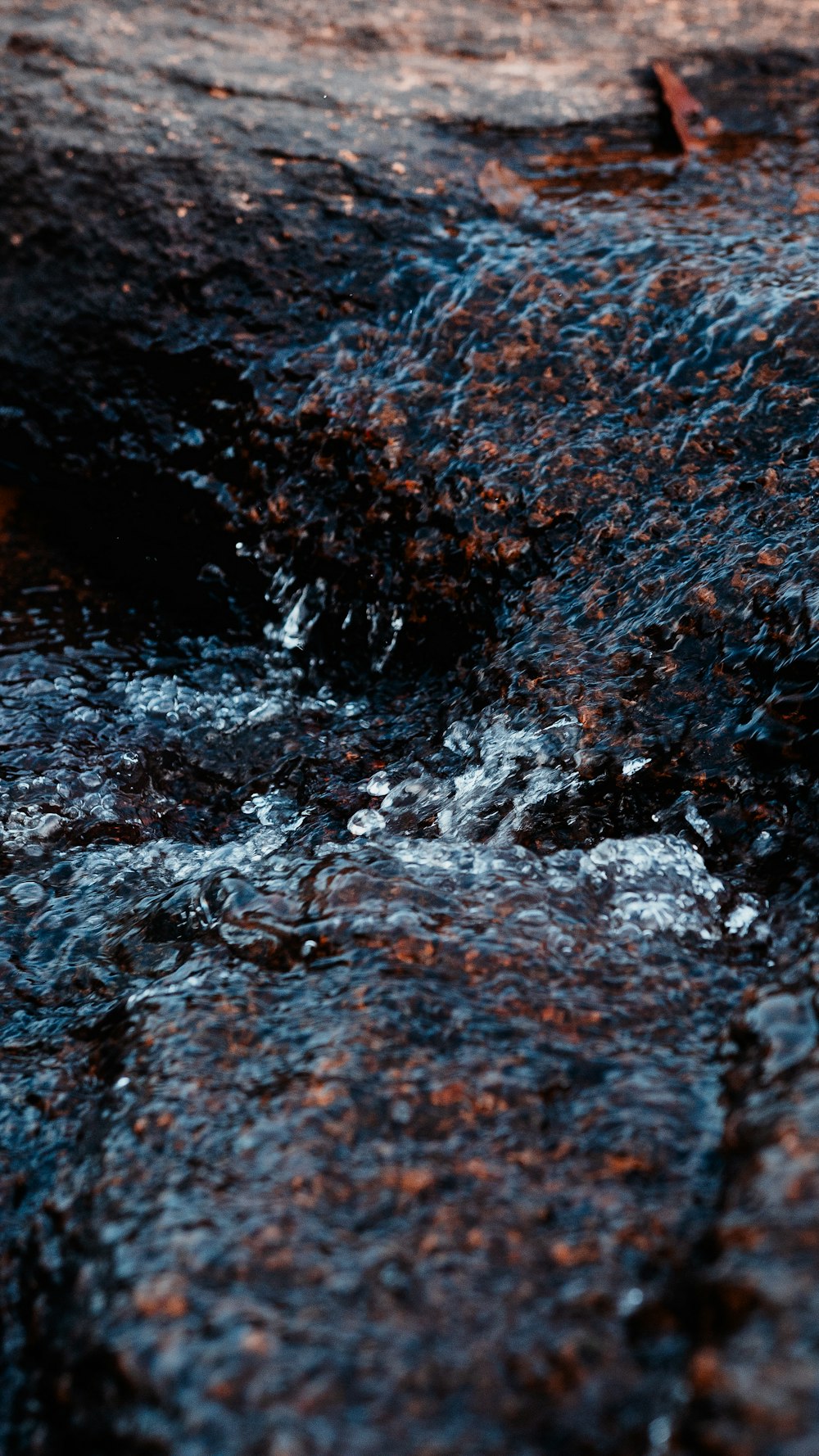 water waves on brown rock