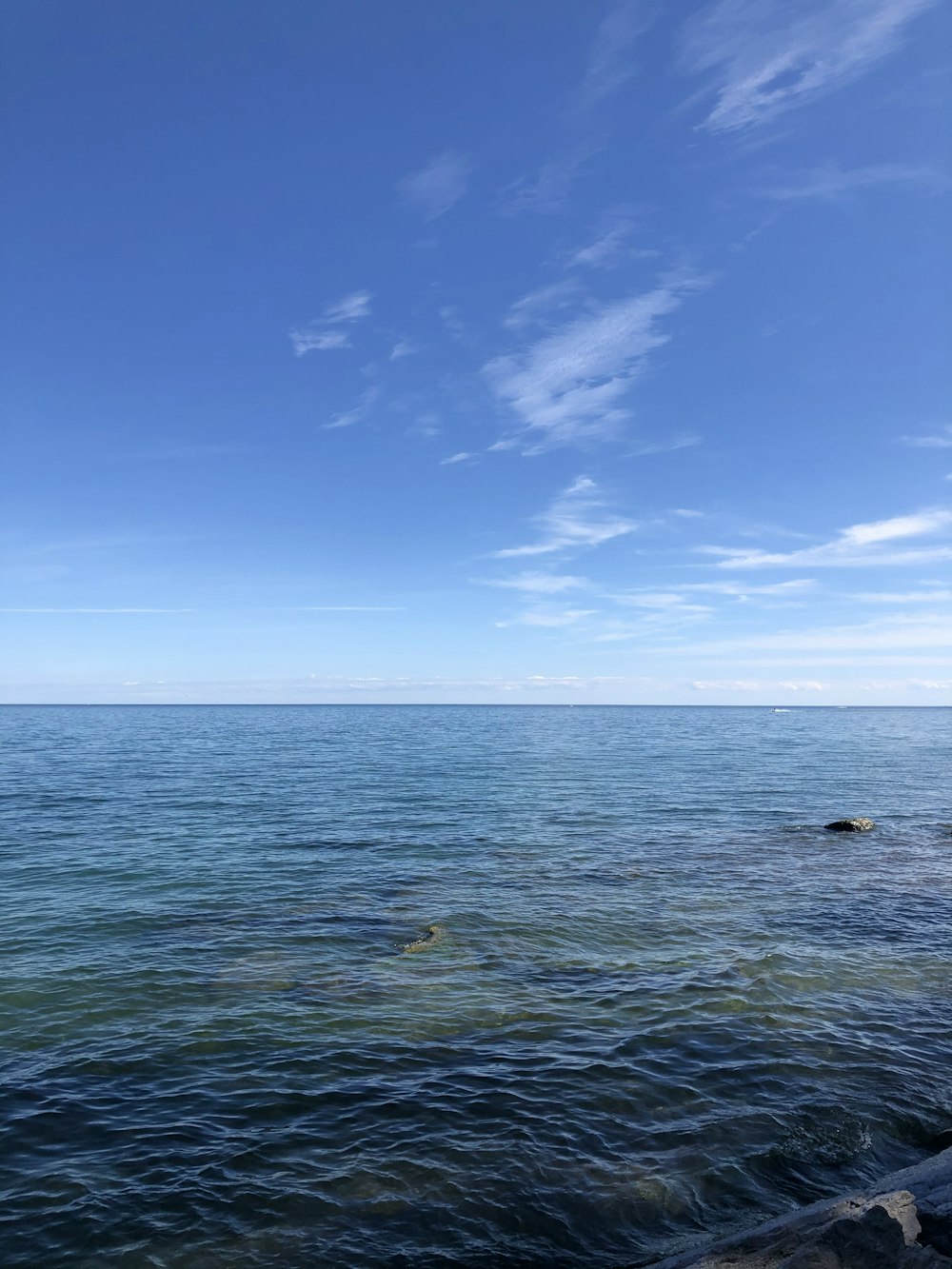 blue sky over sea during daytime