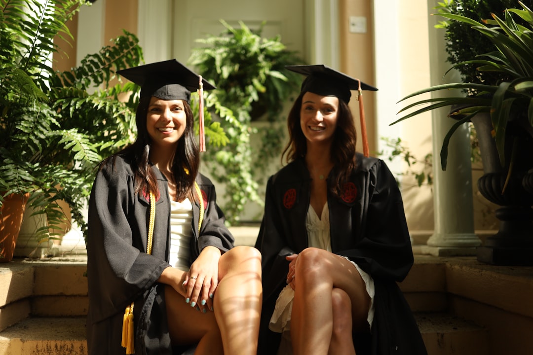 2 women wearing academic dress