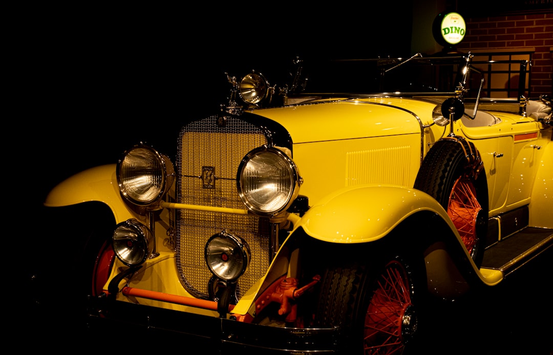 yellow vintage car with black background