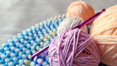 yellow yarn on blue and yellow knit textile knitting google meet background