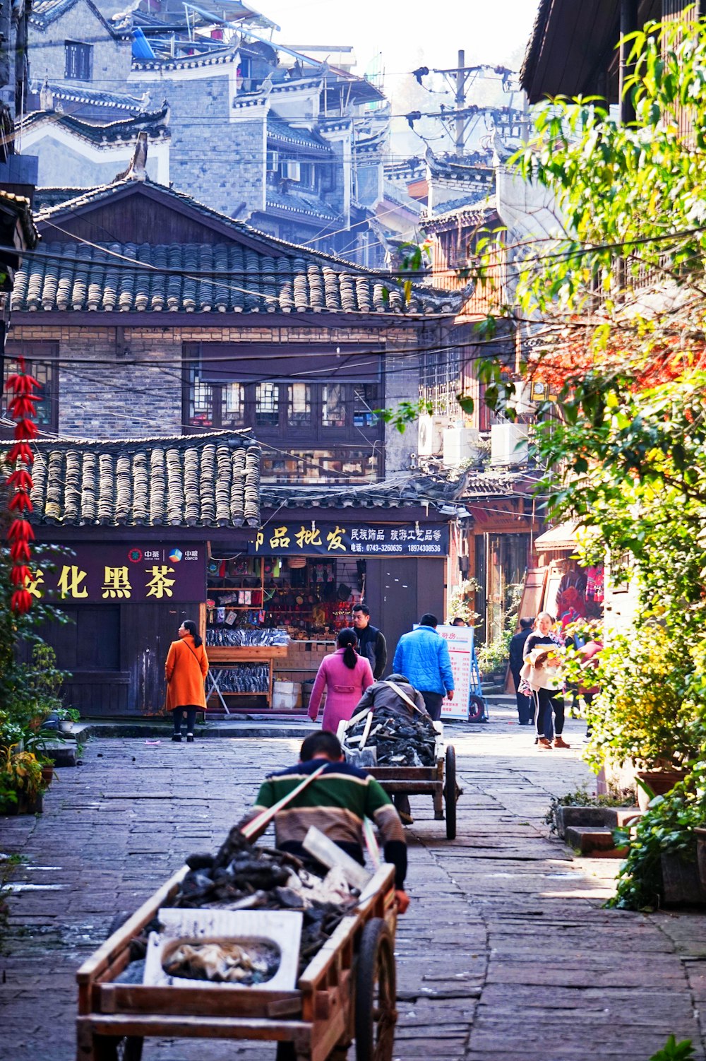 people sitting on bench near building during daytime