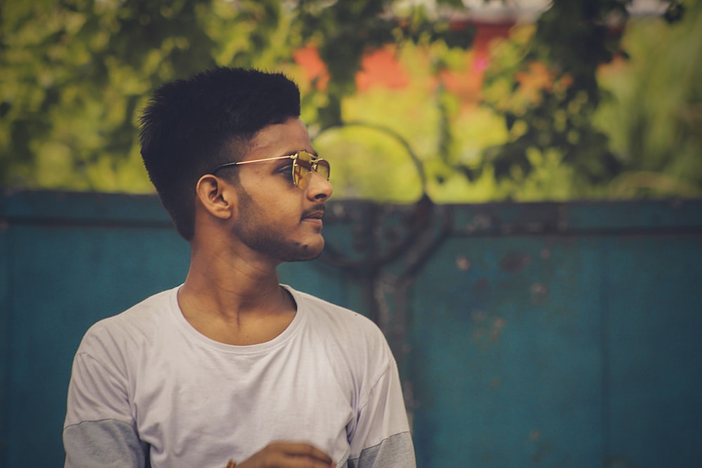 man in white crew neck t-shirt wearing eyeglasses