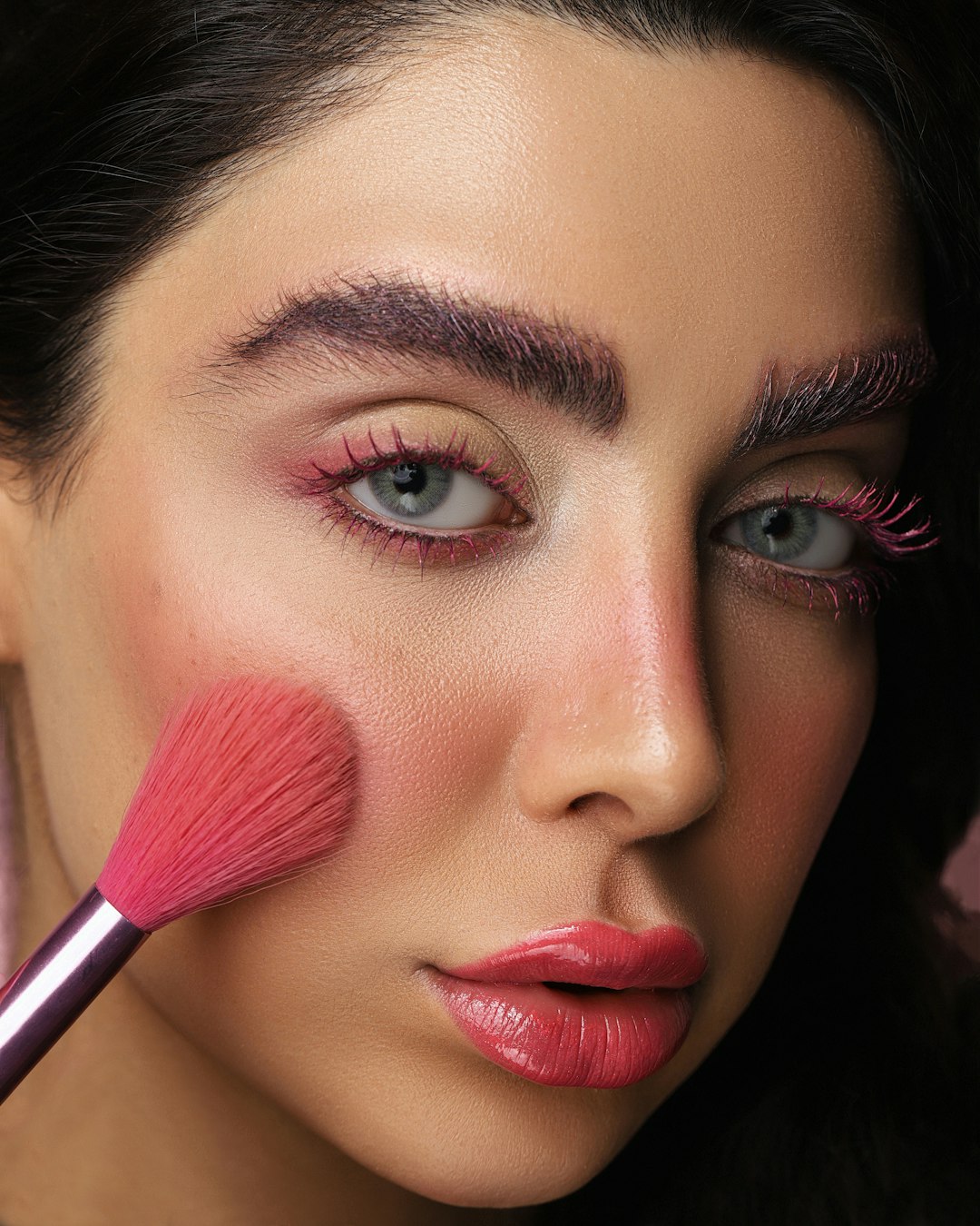 woman with red lipstick and black eyeshadow