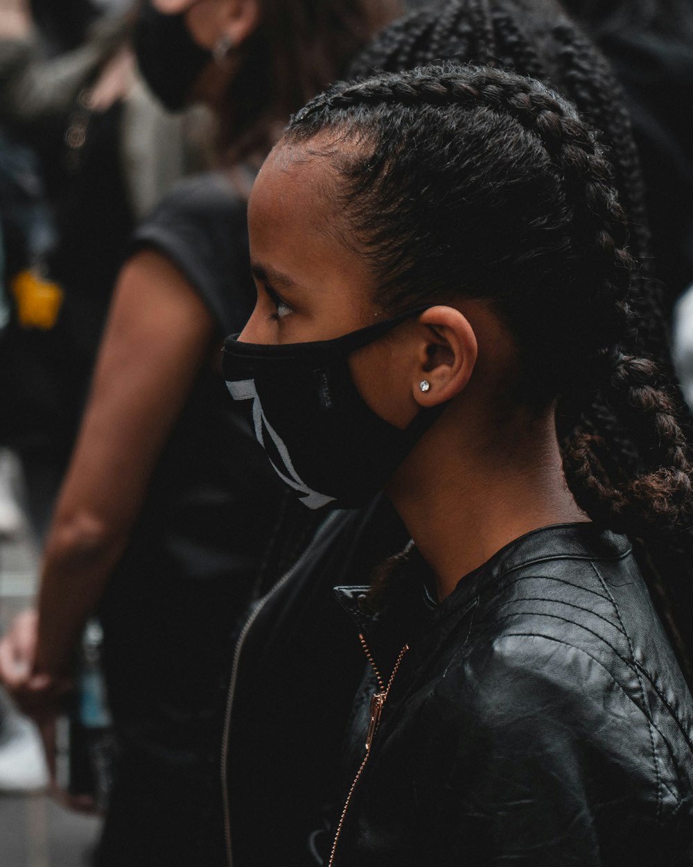 woman in black leather jacket wearing black sunglasses