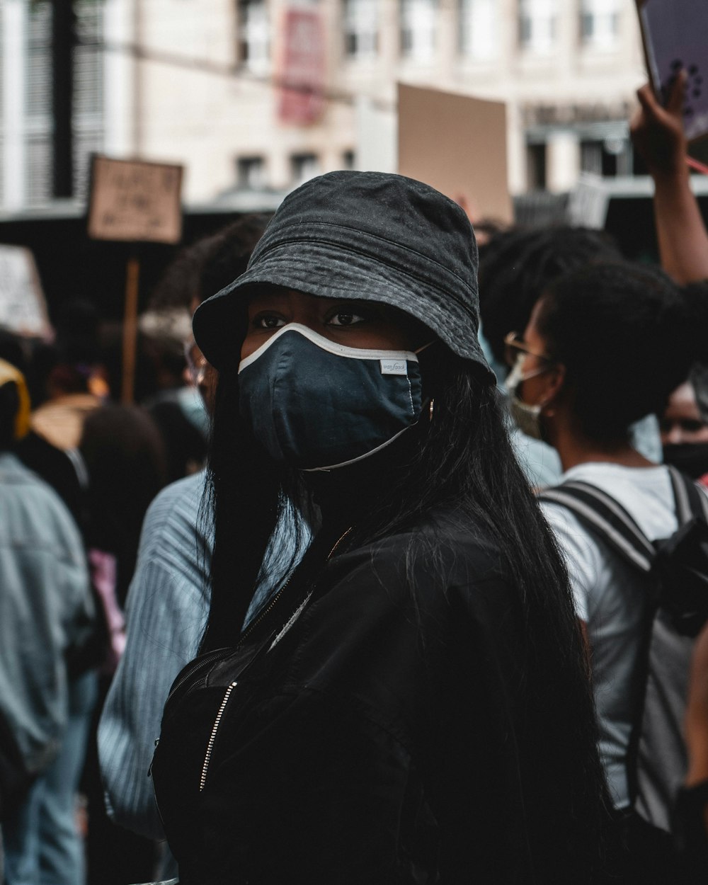 woman in black hoodie wearing black hijab