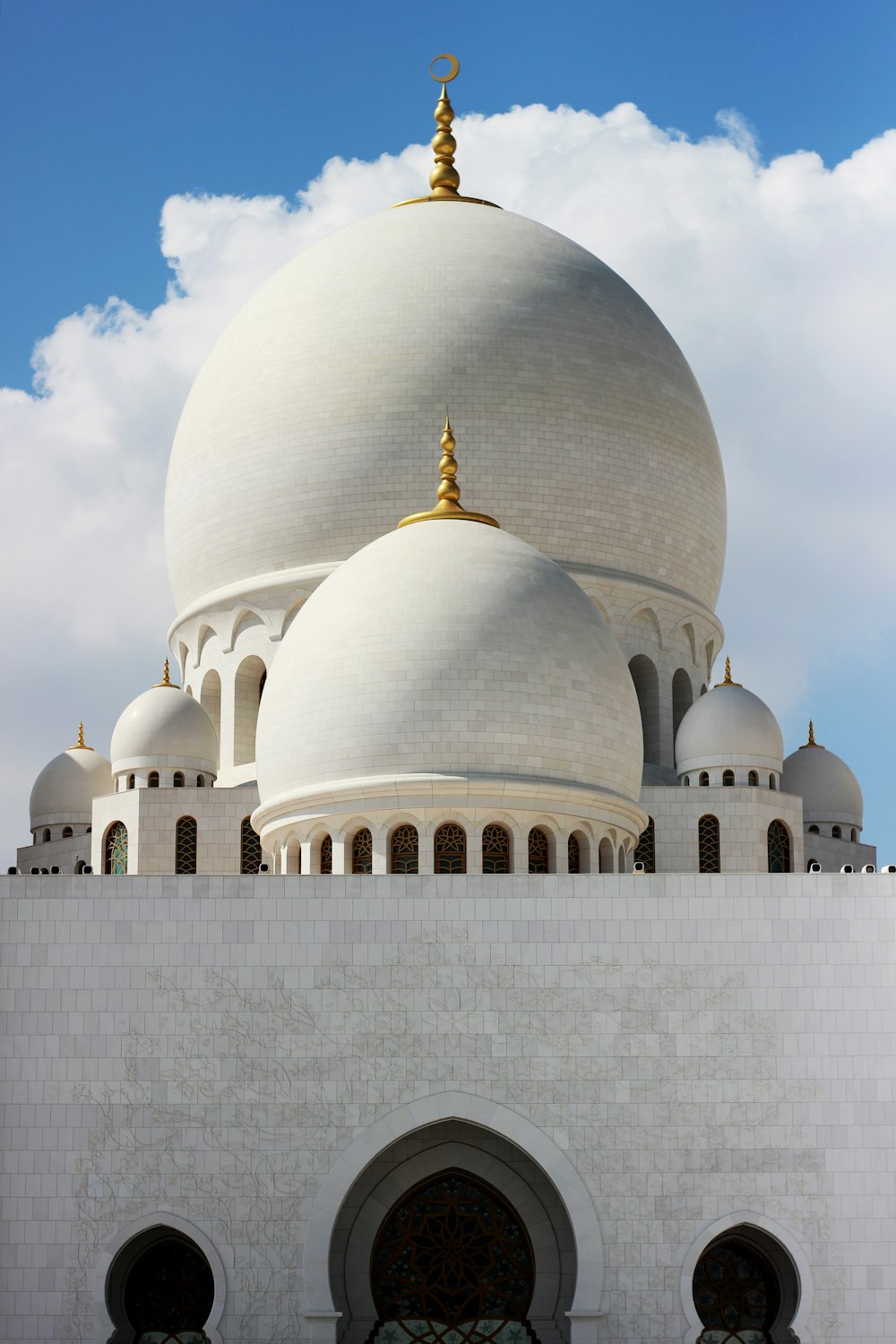 white concrete dome building under blue sky during daytime