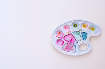 white pink and green round plastic toy watercolor google meet background