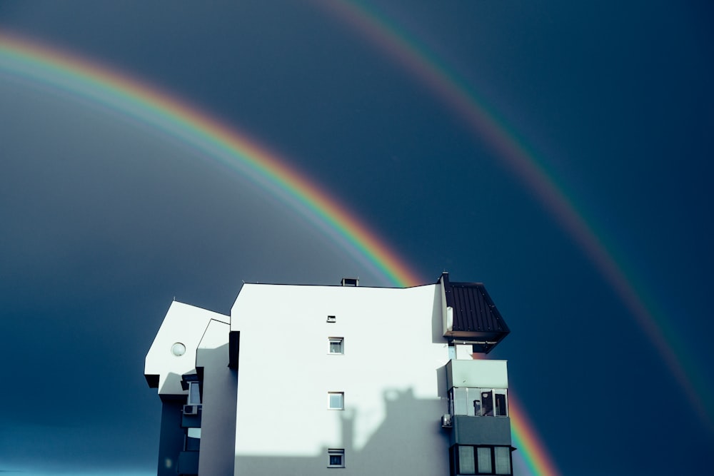 white concrete building with rainbow