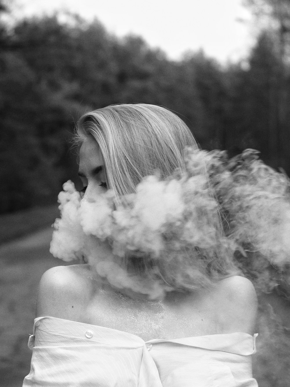 grayscale photo of woman smoking