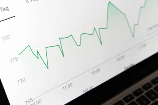 stock market chart displayed on laptop screen