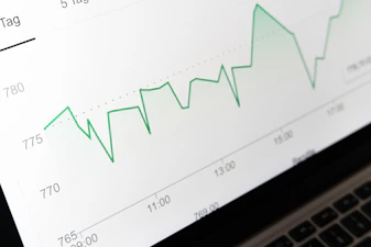 stock market chart displayed on laptop screen