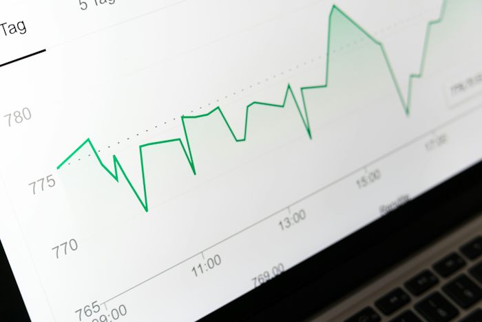 A dark dashboard showing a leverage curve, standing in for a forecast projected from historical data