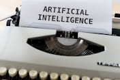 artificial intelligence white and black typewriter with white printer paper