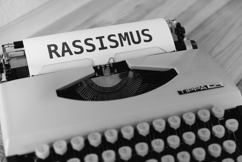 a black and white photo of an old fashioned typewriter