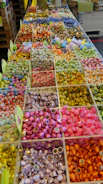 Close-up of colorful candy ingredients arranged artistically on a wooden table