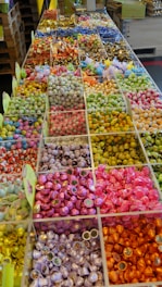 A vibrant display of assorted international chocolates and sweets arranged neatly on a wooden table.