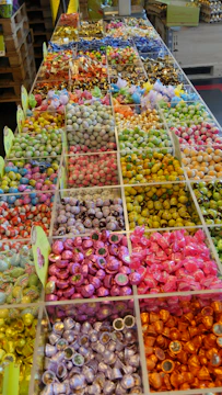 Close-up of colorful candy ingredients arranged artistically on a wooden table