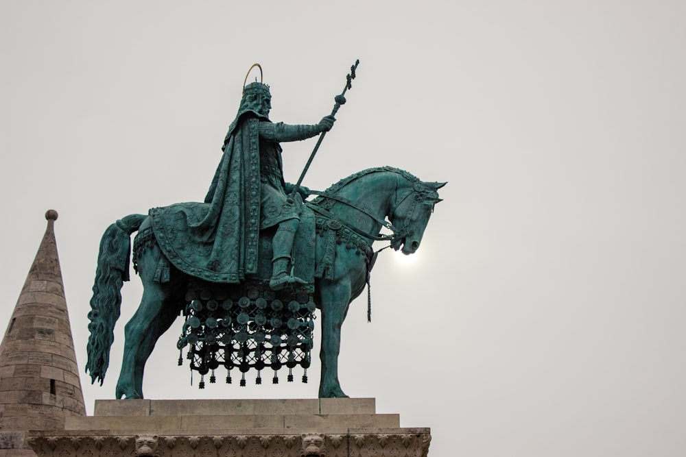 black statue of man riding horse
