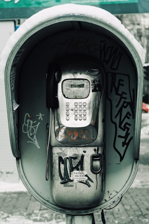 An outdoor setting featuring the Snow Phone in use, highlighting its rugged design.