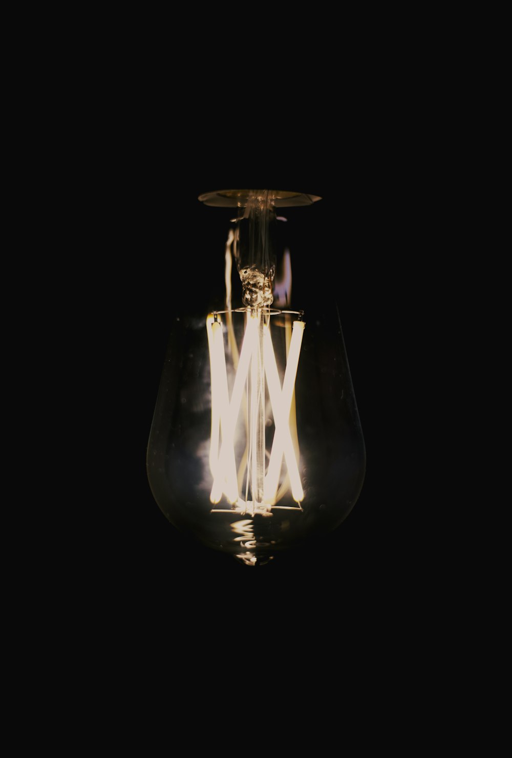 clear glass light bulb with light