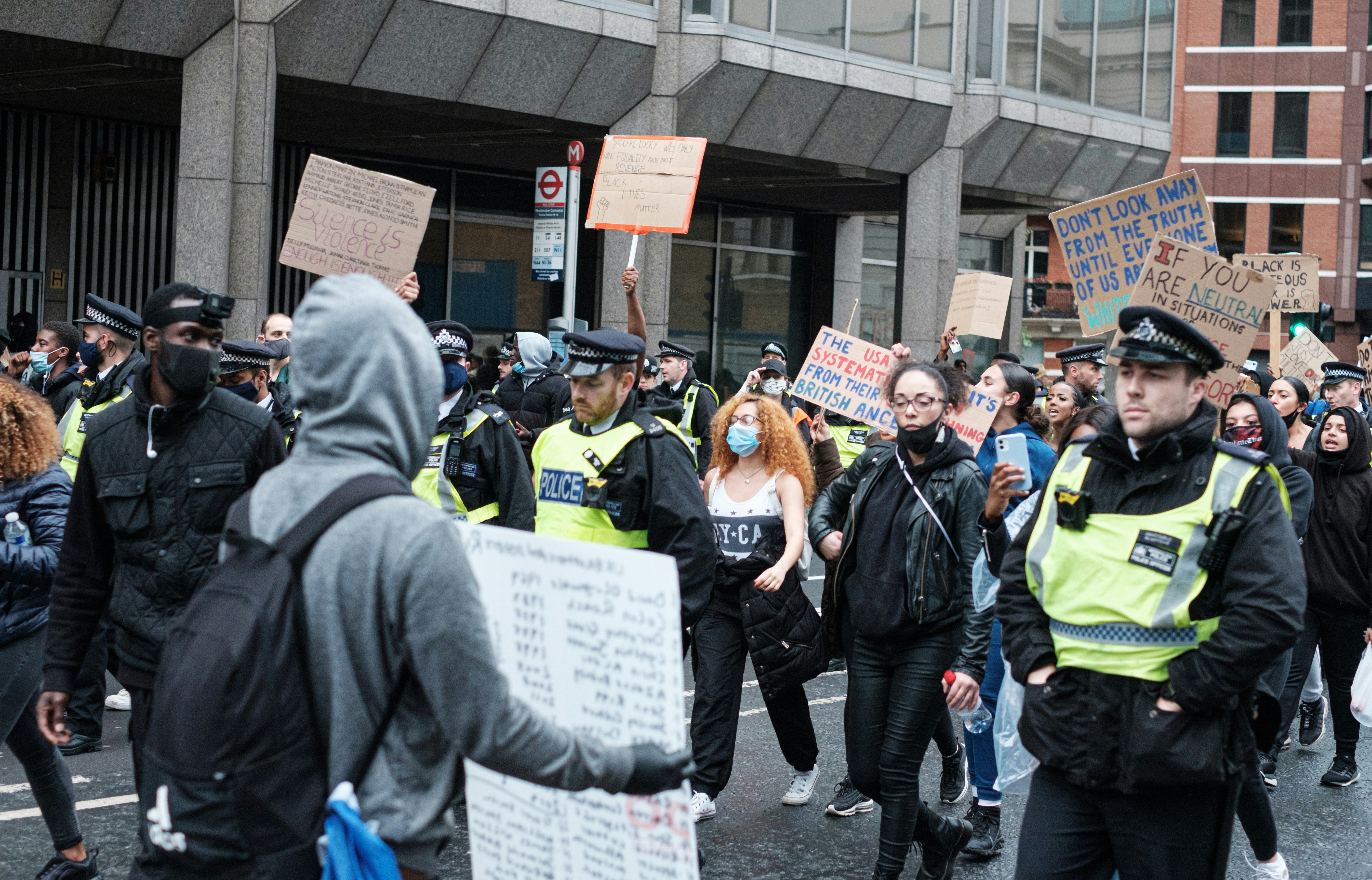 people standing near brown building during daytime