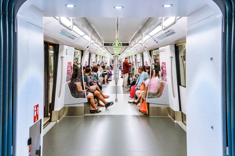 people sitting on train seat