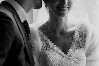 grayscale photo of woman in white floral lace top