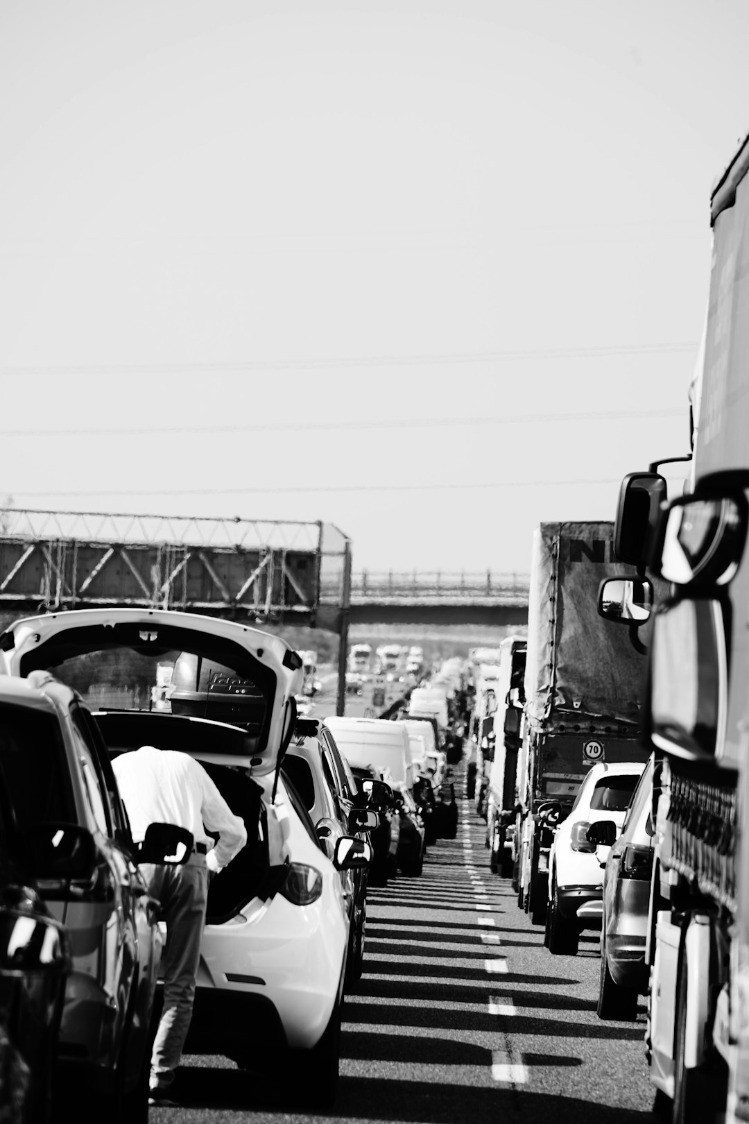 grayscale photo of cars on road