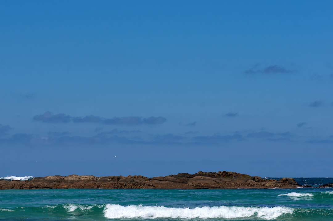 blue sea under blue sky during daytime