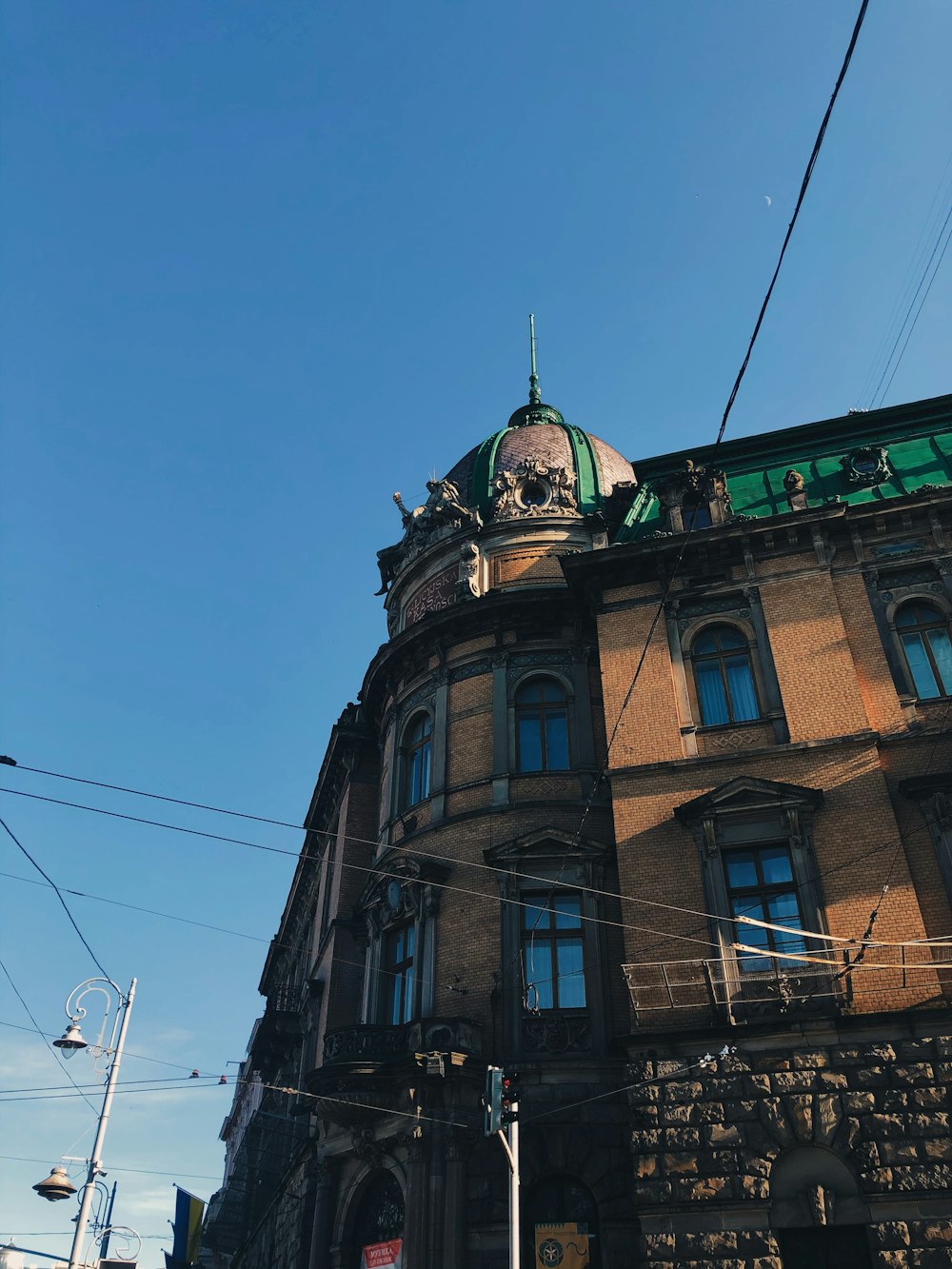 brown concrete building under blue sky during daytime