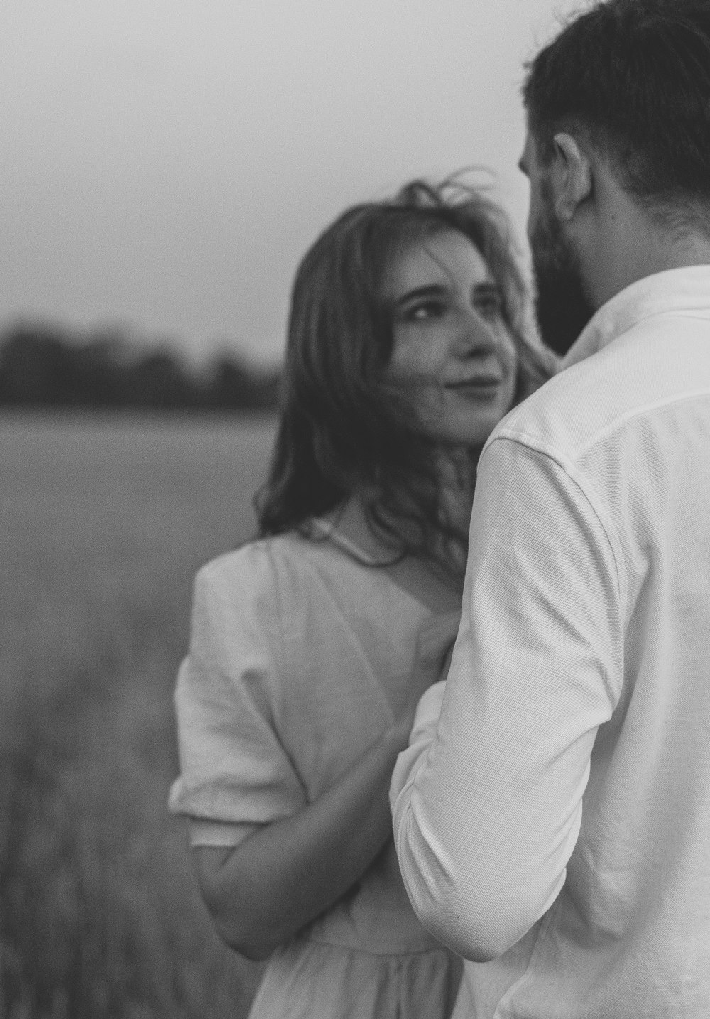 grayscale photo of couple kissing