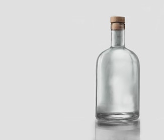 clear glass bottle with white background