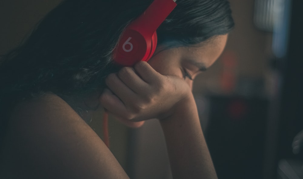 a woman with headphones on her ears