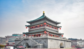 white and brown concrete building under white sky during daytime
