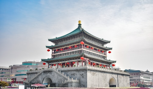 white and brown concrete building under white sky during daytime