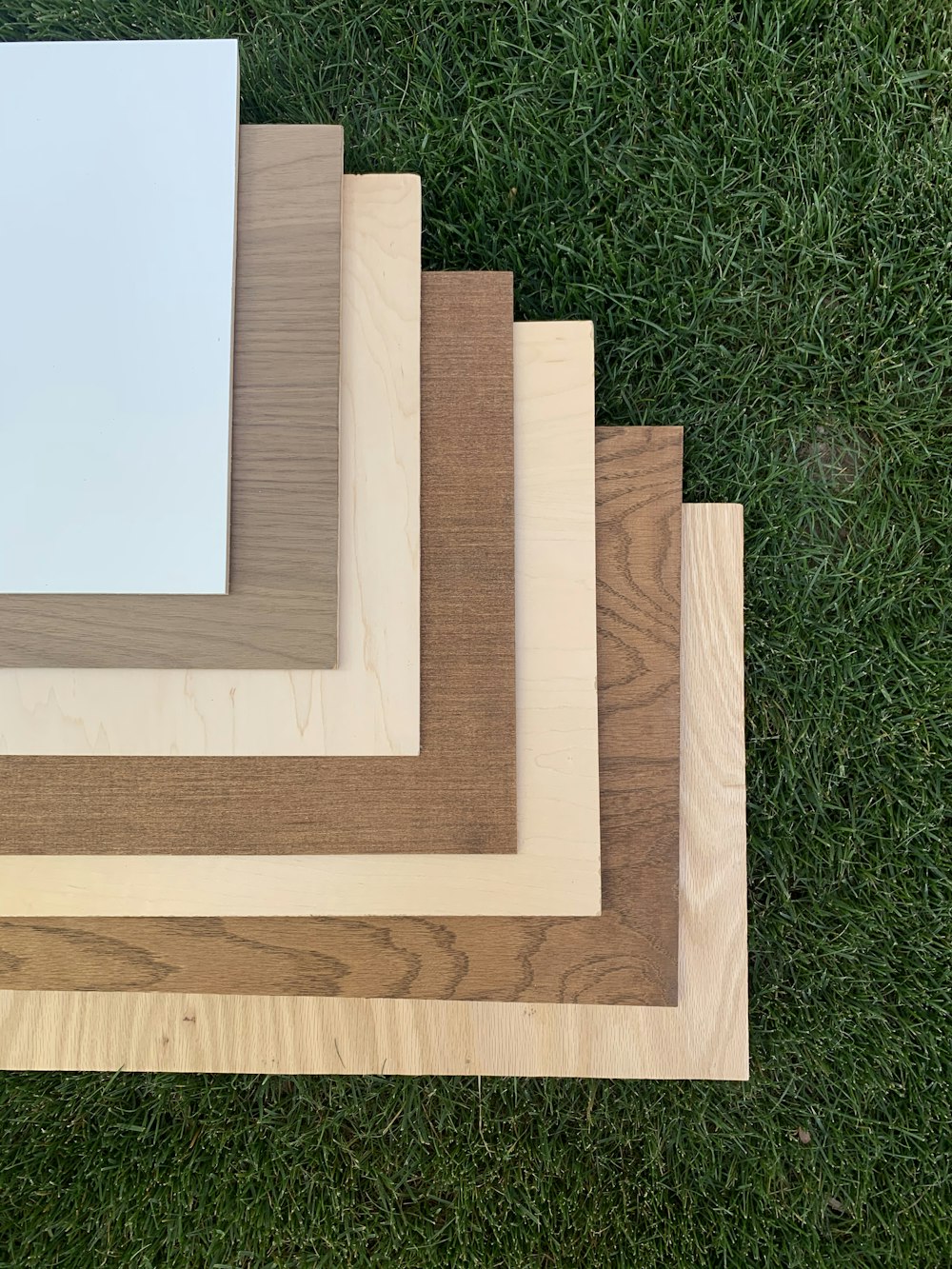 brown wooden frame on green grass