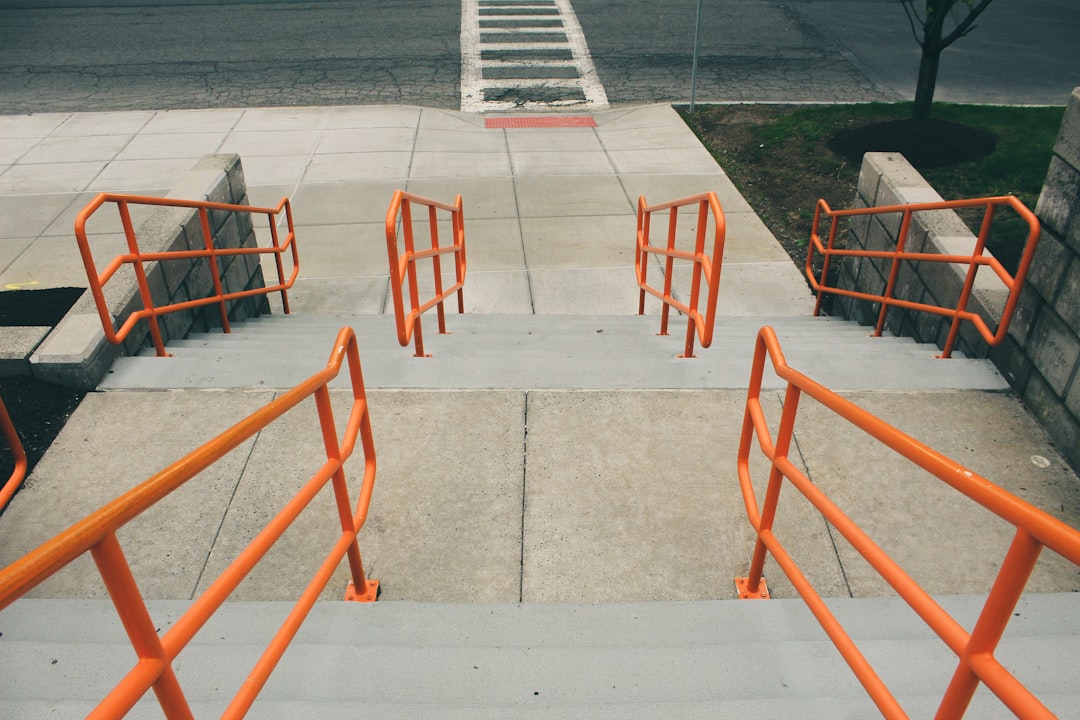 Street Stairway With Orange Handrails