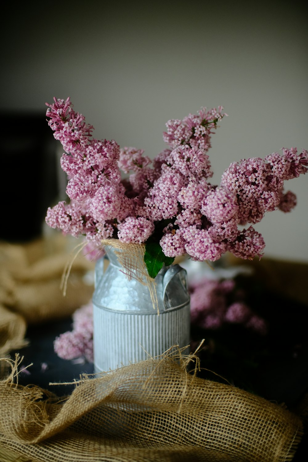 pink flowers in clear glass vase