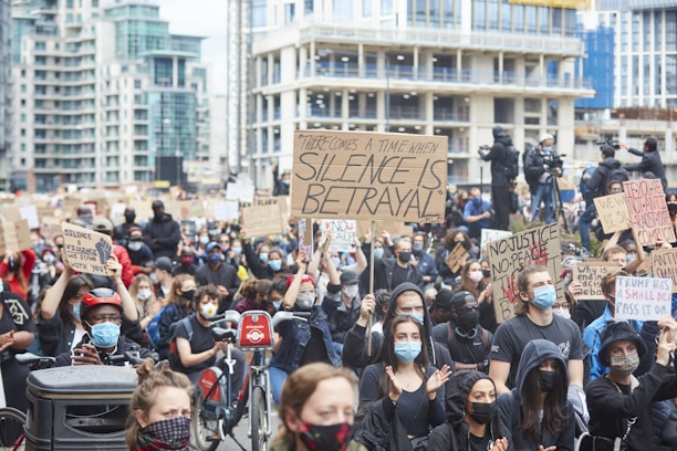 A Justice Rally electric bike with digital campaign signs and a loudspeaker rolling through downtown streets.