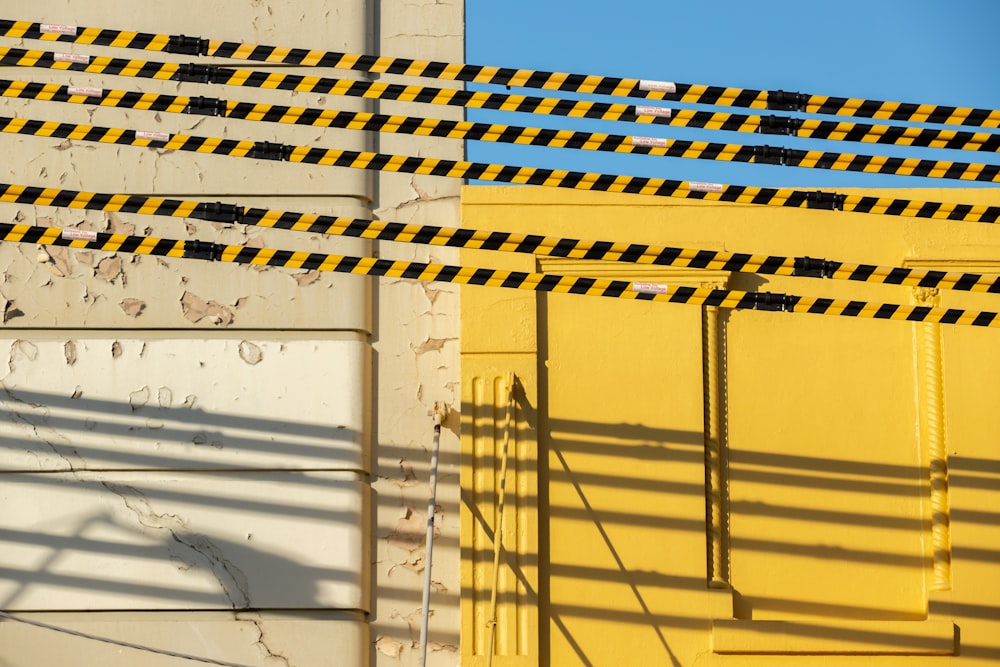 yellow metal fence during daytime