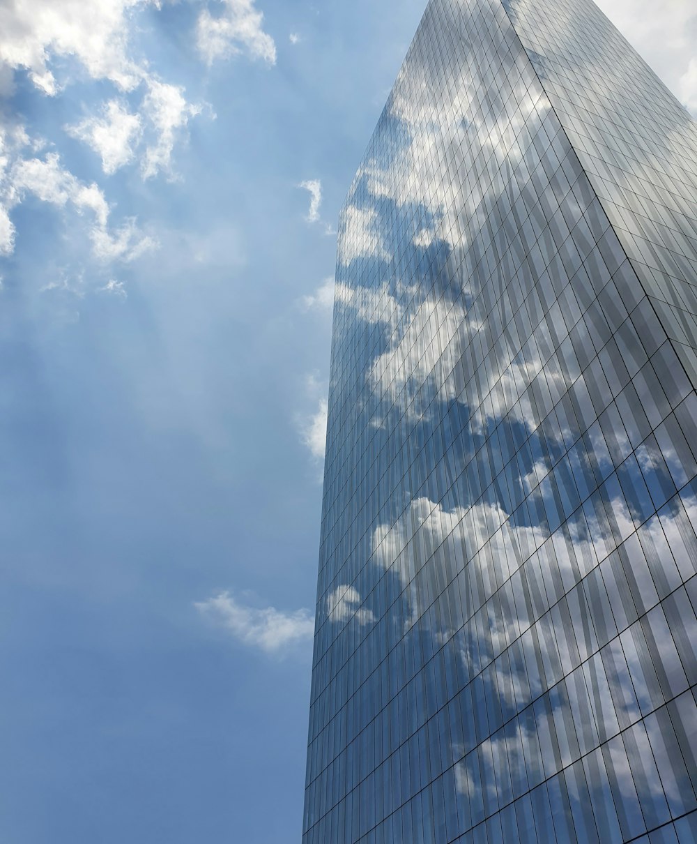 blue glass building under blue sky during daytime